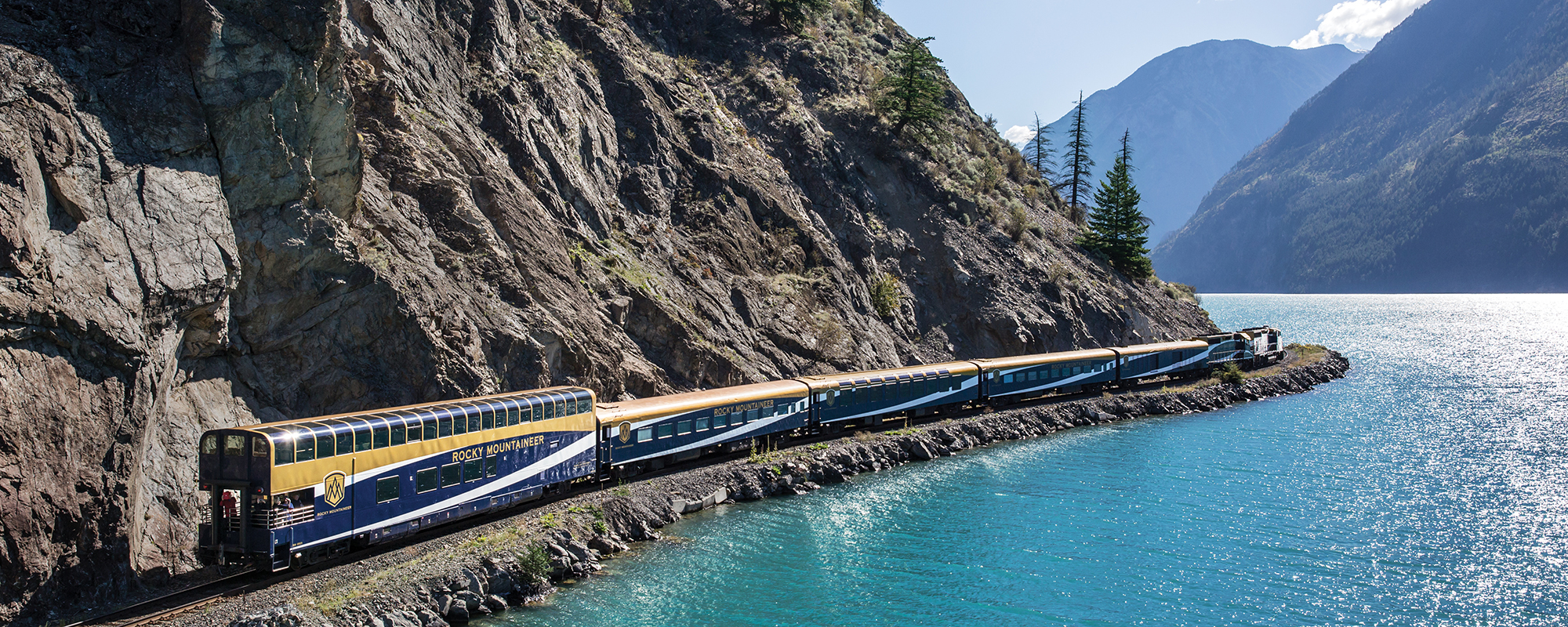 Rocky Mountaineer train travelling by a beautiful river