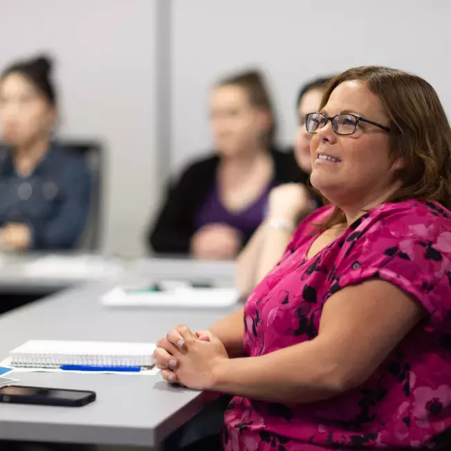 CAA employees in a meeting