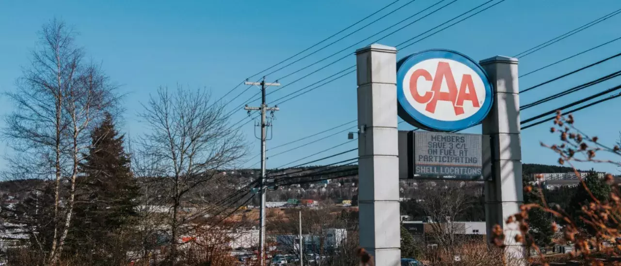 Large CAA billboard with a wintery city in the background