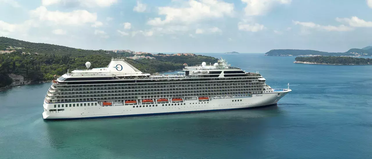 Cruise ship visiting a scenic harbour