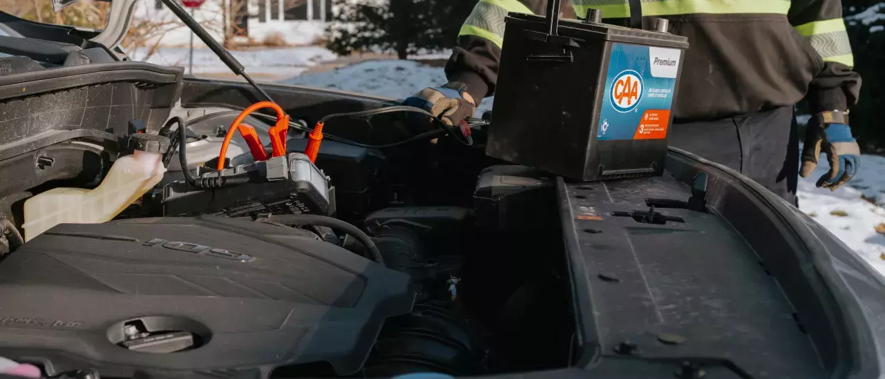 CAA technician replacing a car battery