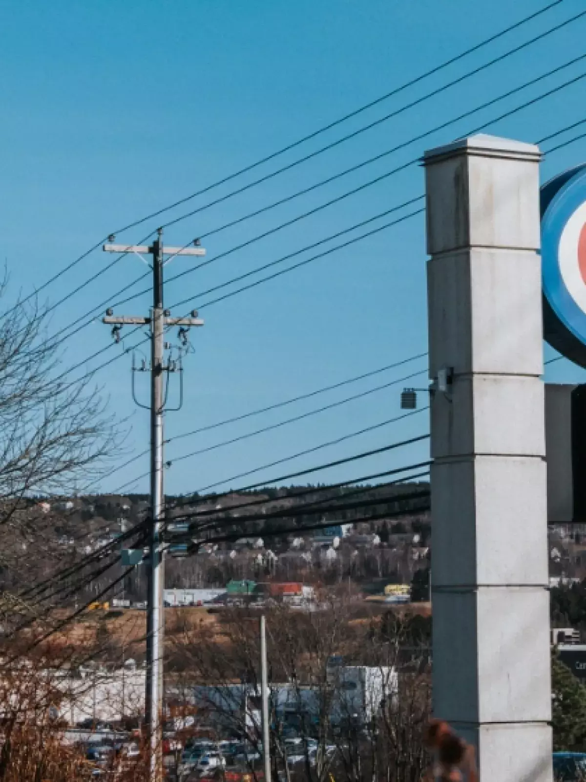 Large CAA billboard with a wintery city in the background