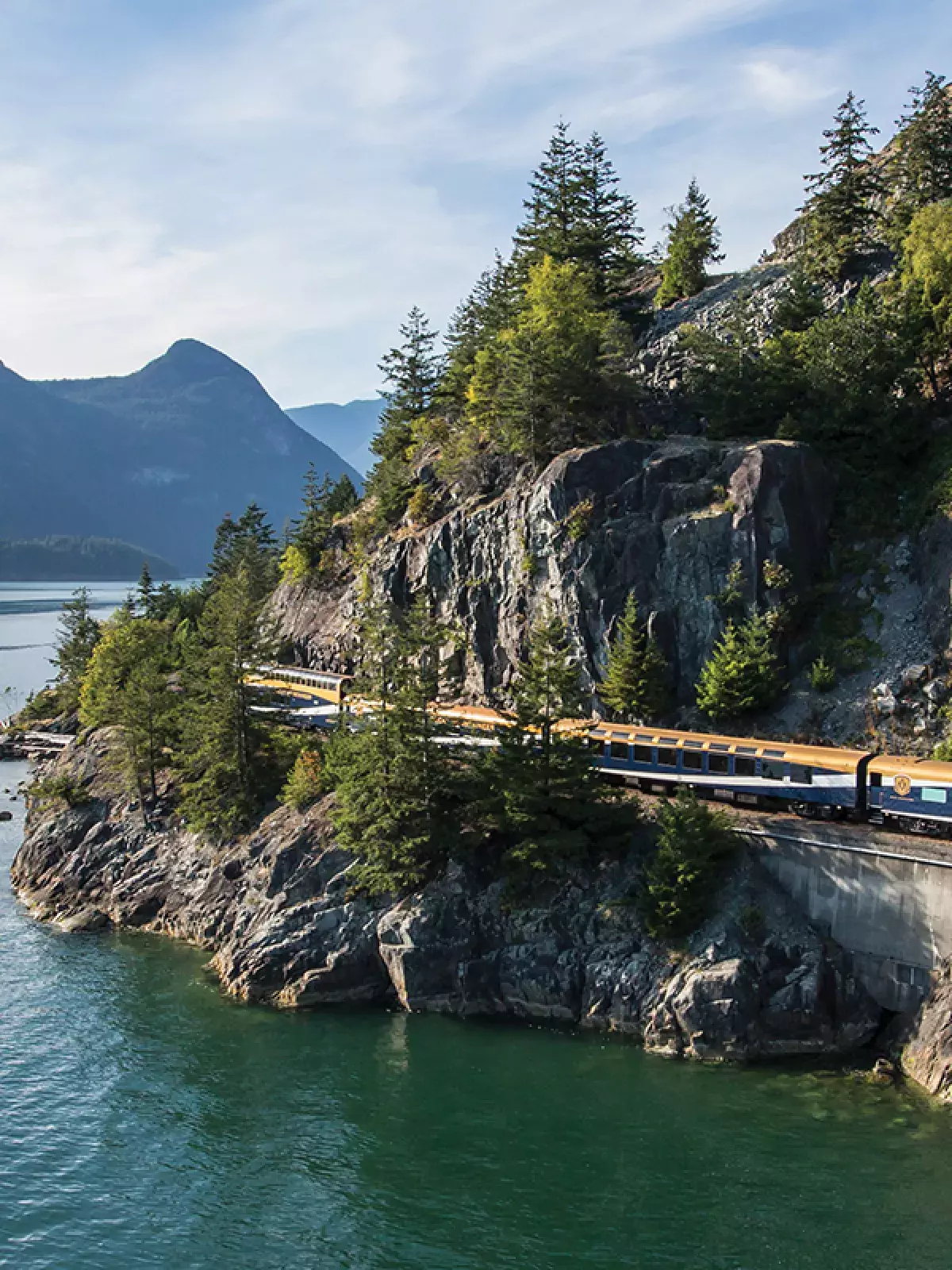 A train moving along a rocky coastline