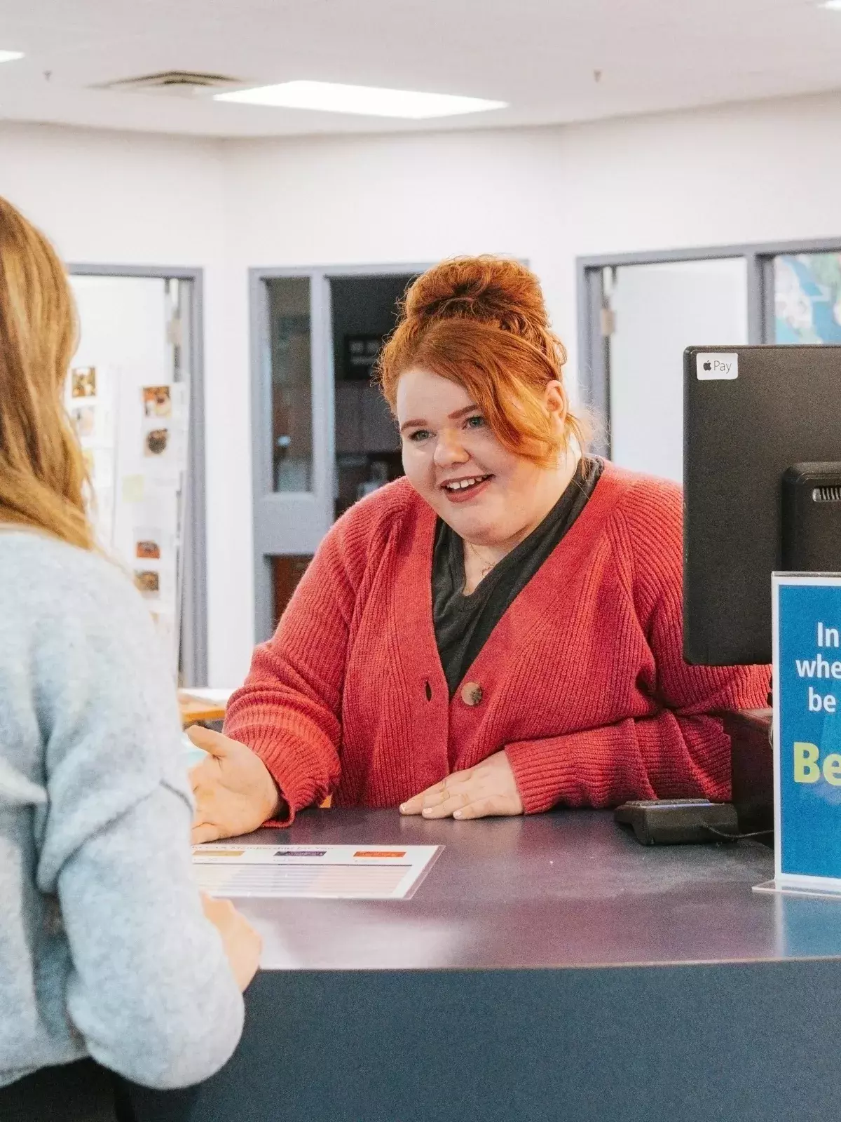CAA Employee helping a customer