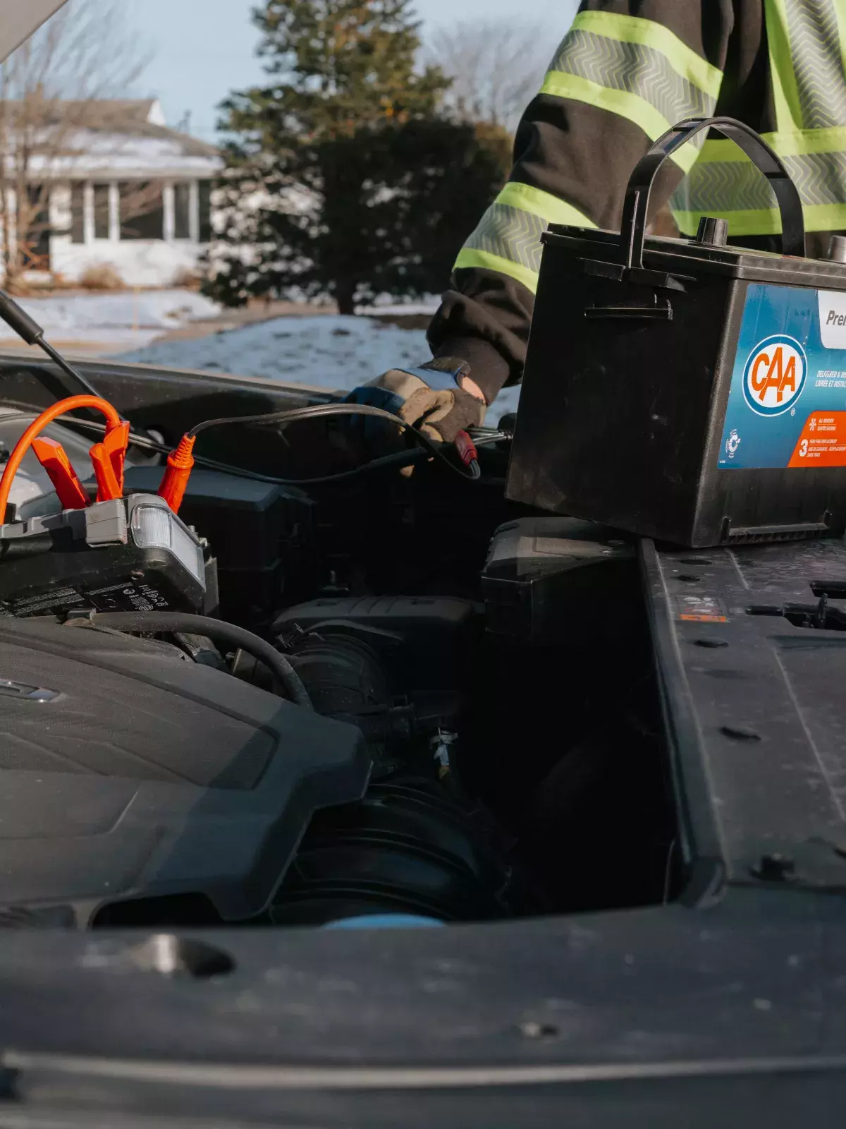 CAA technician replacing a car battery