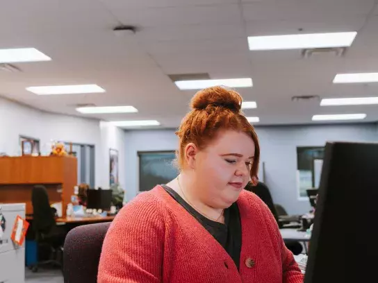 Woman sitting at computer