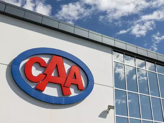 CAA sign on the side of a building with lots of windows