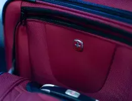 Red swissgear suitcase