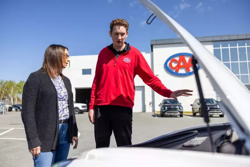 CAA employee demonstrates an EV