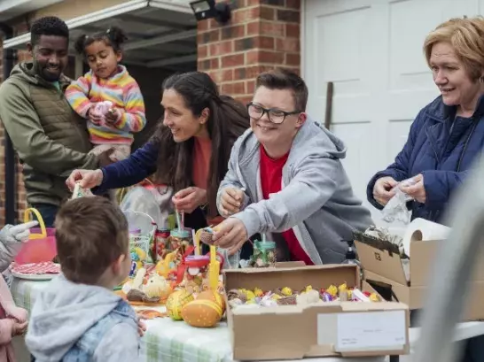 Volunteers handing out toys to children