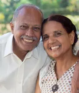 Retired couple smiles at the camera