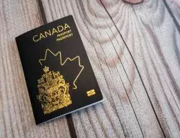 Canadian passowrd lays on a wooden surface