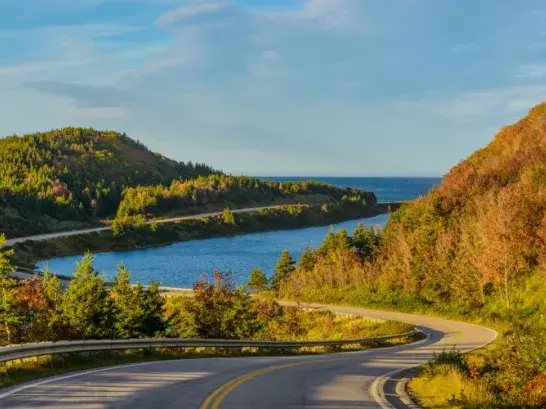 Winding road with the ocean in the background