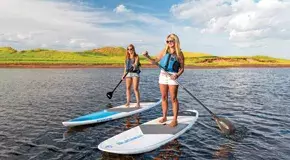 two people paddling on a sup paddleboard