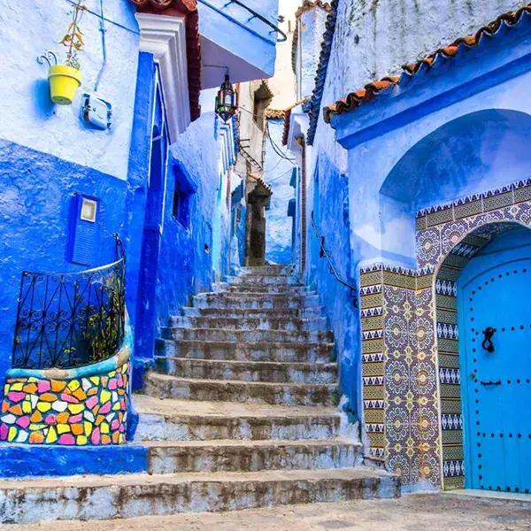 Stairs in Morocco between two blue buildings