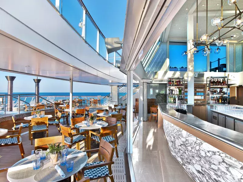 Outdoor dining area and bar on cruise ship