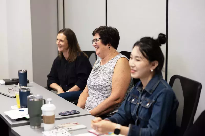 People smiling in team meeting